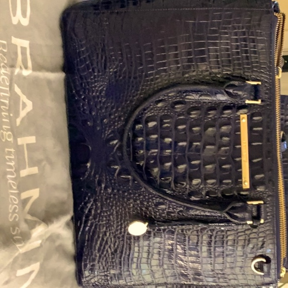Brahmin Business tote with outside slip and 3 sections-2 with zippers.
